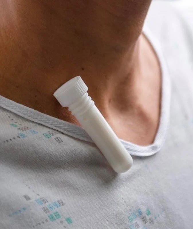 AethereoStick clip on neck of patient gown